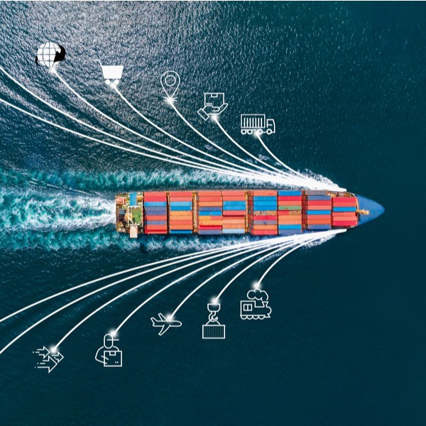 top-down view of a container ship sailing on an open ocean transporting container freight