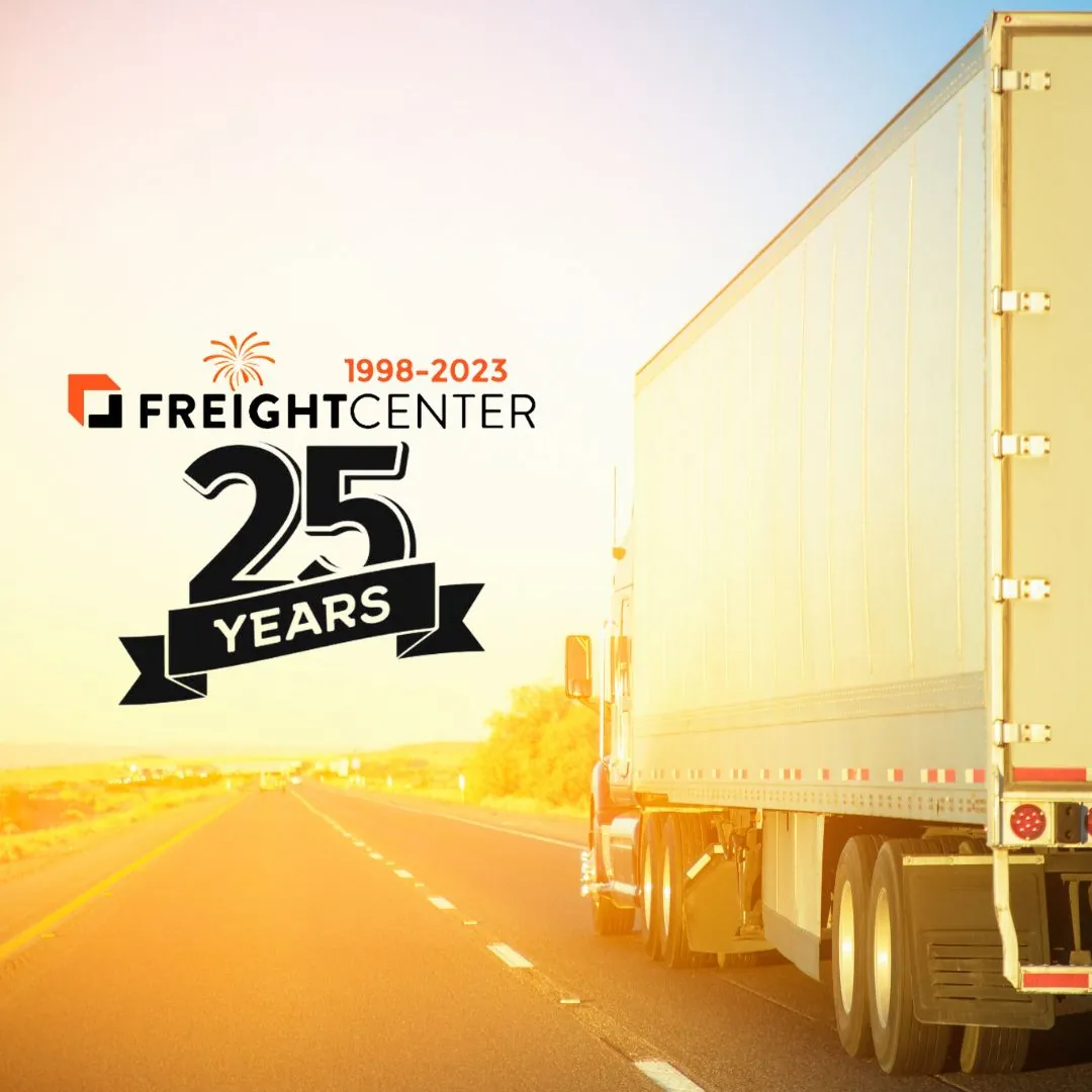 truck driving toward sunset with a FreightCenter 25 years in business logo