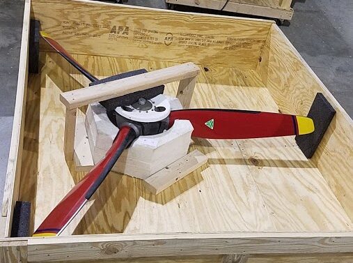 single aircraft propeller packaged in an open crate