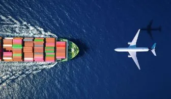aerial view of container ship sailing and airplane flying resized