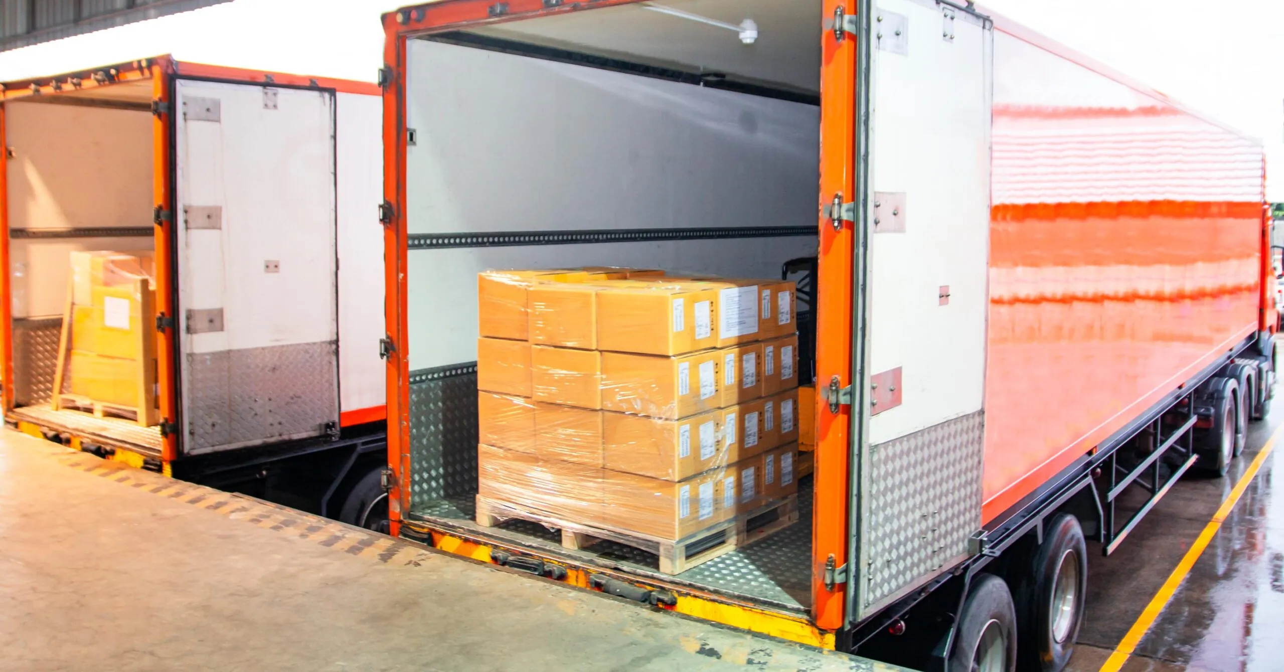 orange freight trailer with pallet