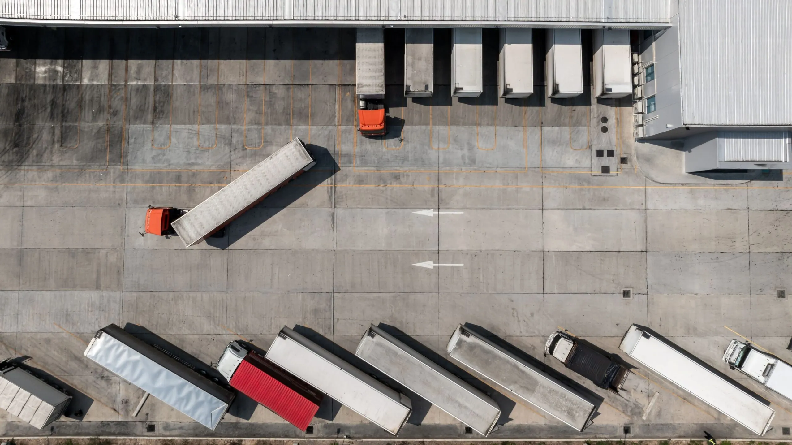 top down view of trucks parked at a warehouse