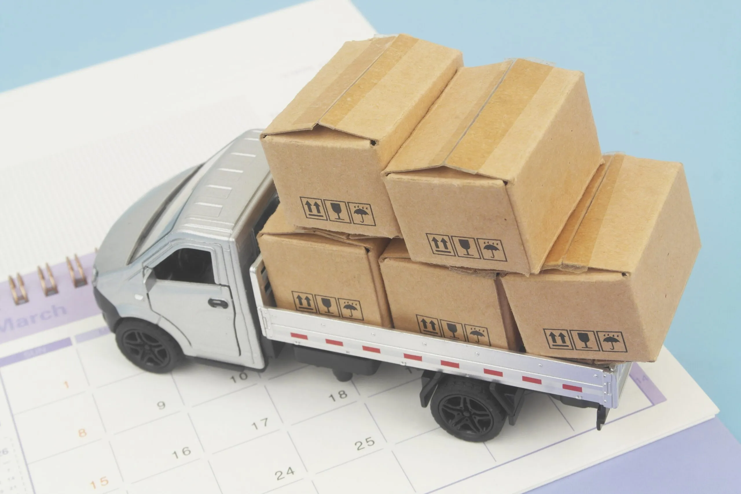 small truck with many boxes on calendar