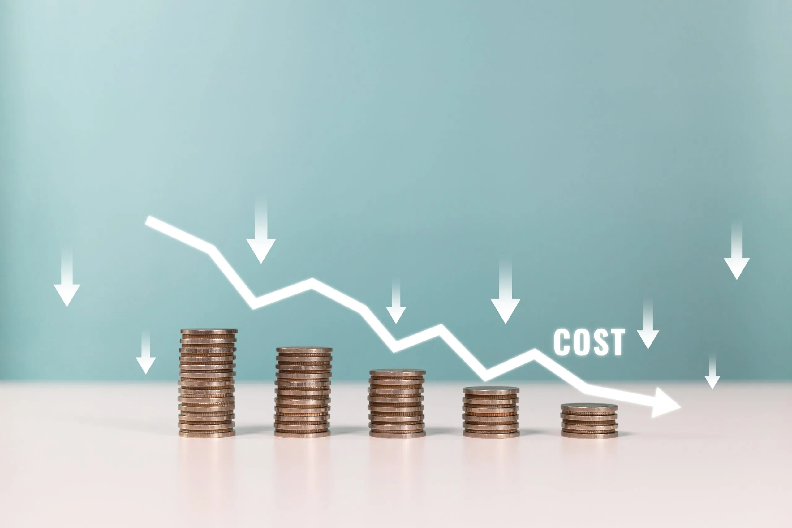 stacks of coins shrinking graph with low cost, trucking costs per mile