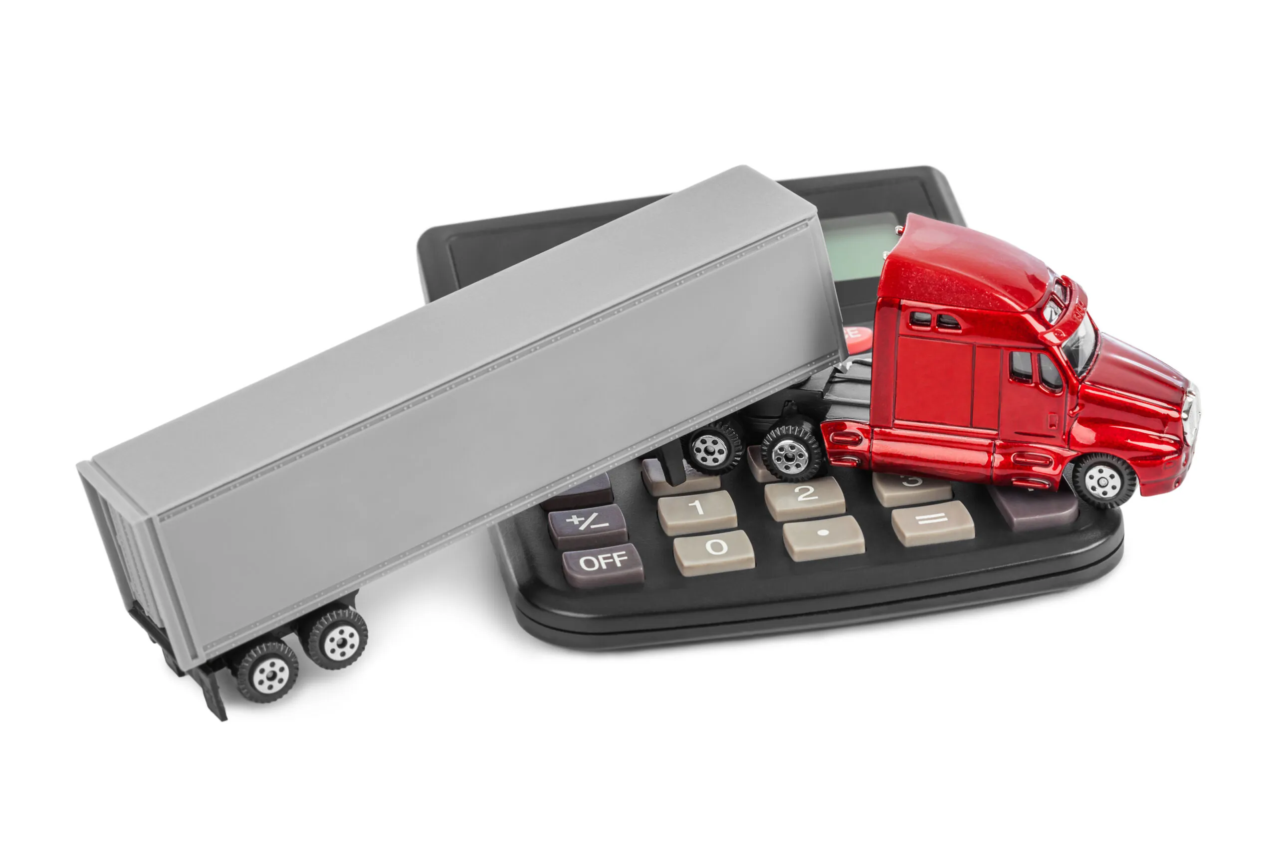 toy semi truck on top of calculator