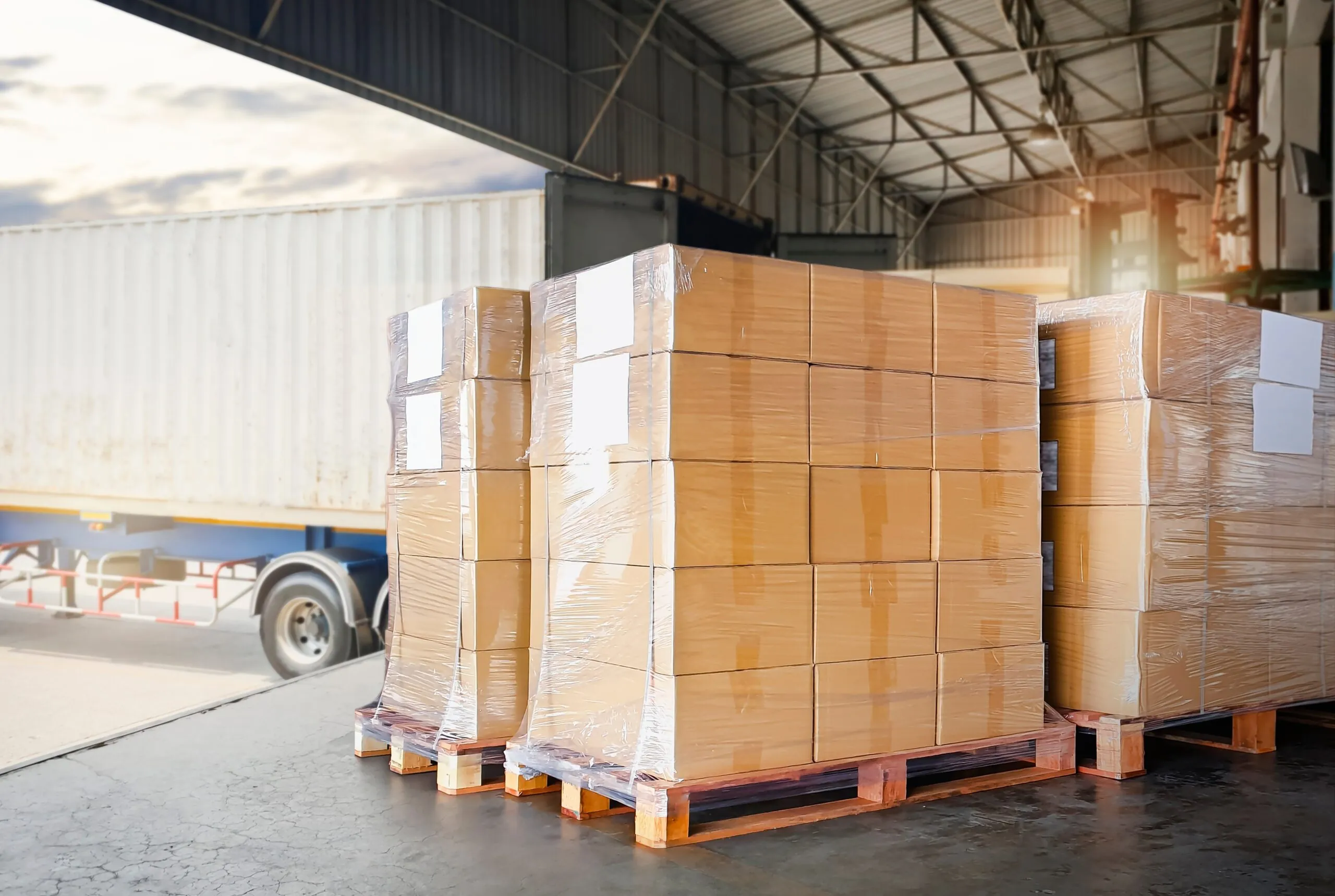 palletized shipments on loading dock near truck