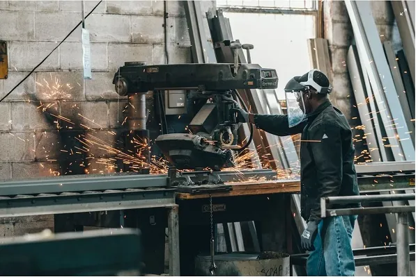 man working on a welding machines