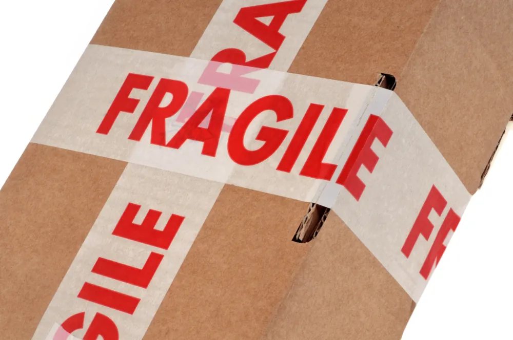corrugated box with big fragile tape on it