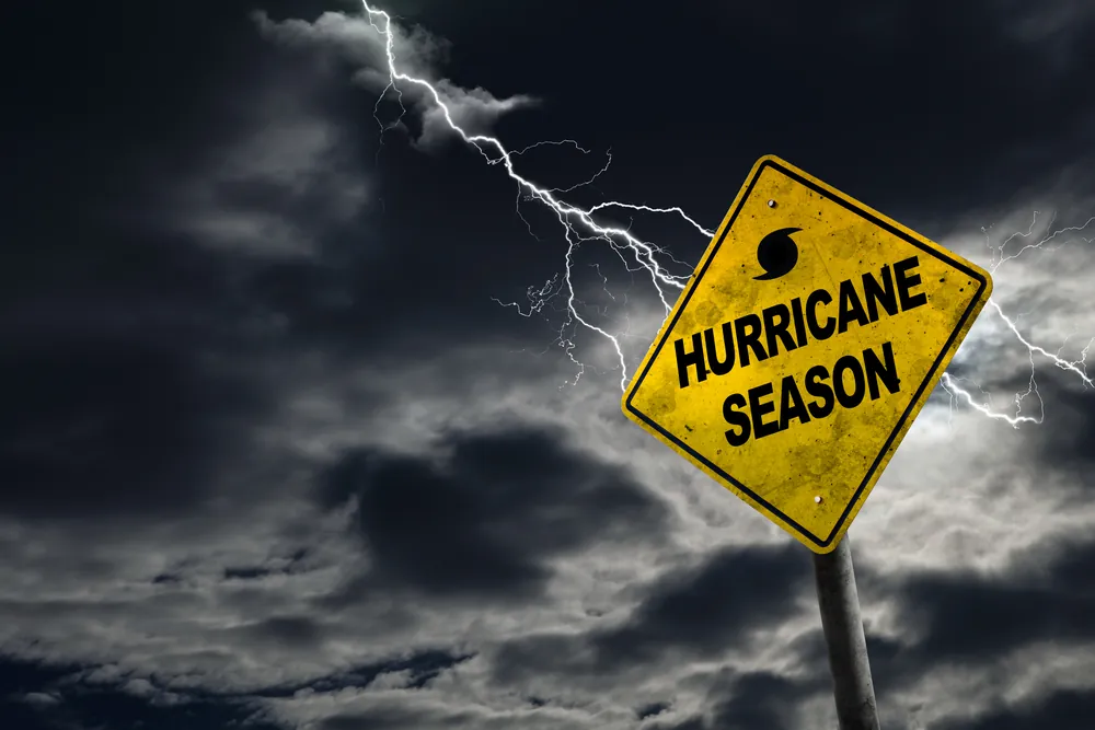Hurricane season sign with a storm in the background