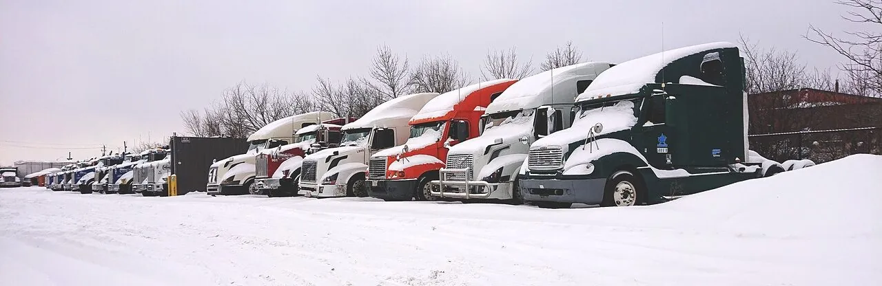 trucks stuck in lot during bad weather to evacuate