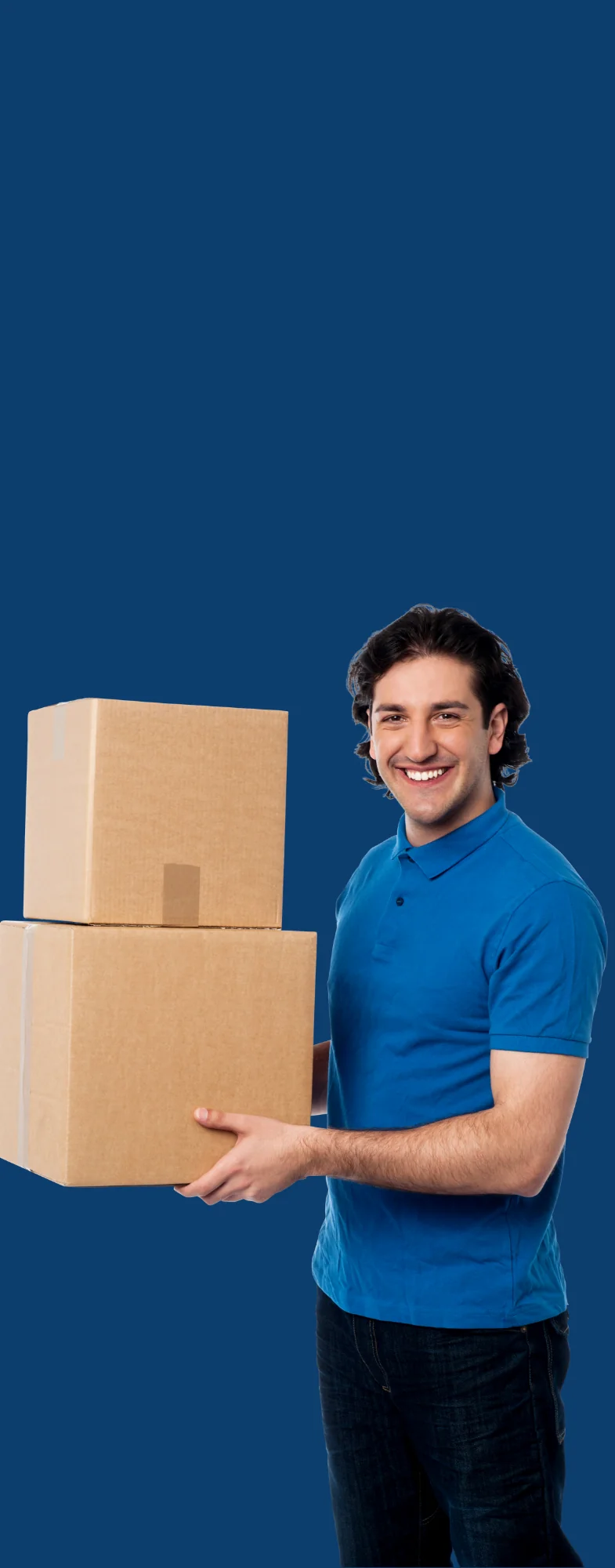 A gentlemen wearing a blue shirt holding two boxes and smiling