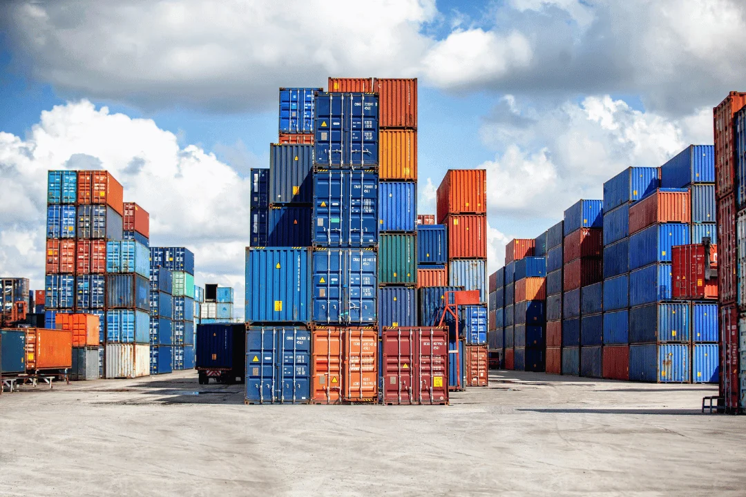 15 Interesting Facts About Shipping Containers stacked shipping containers at a loading port