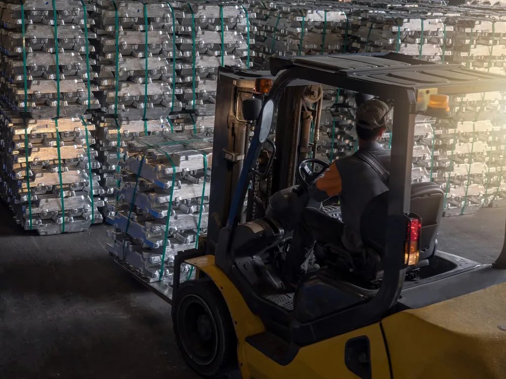 Inbound Logistics forklift carrying aluminium ingots on pallets