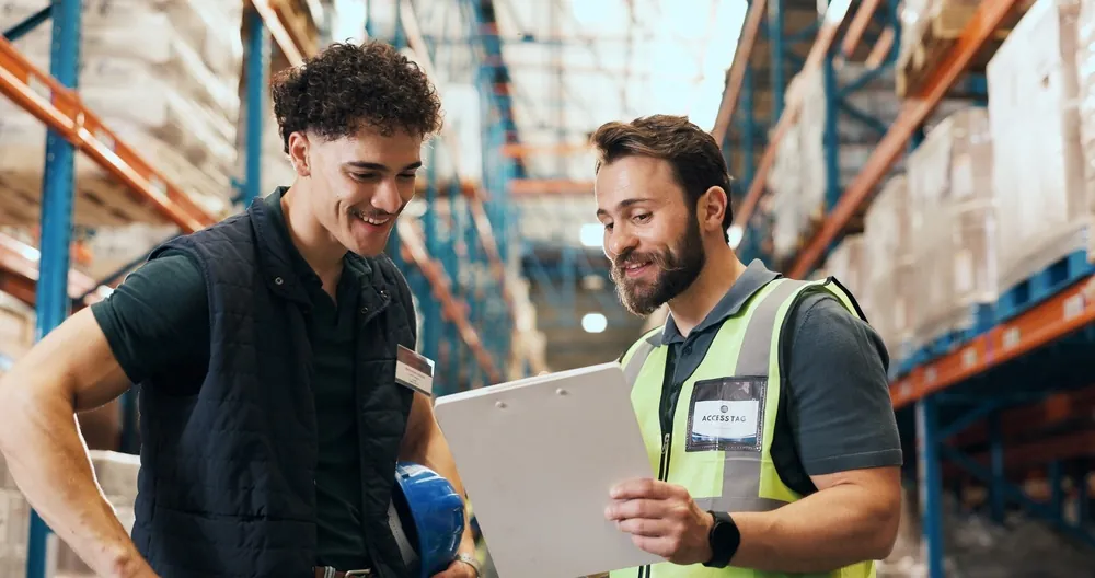 Outbound Logistics two warehouse workers discussing data