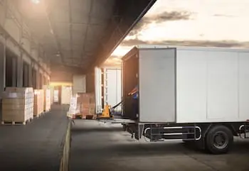 Outbound Logistics white semi trailer being unloaded at a loading dock PREVIEW VERSION