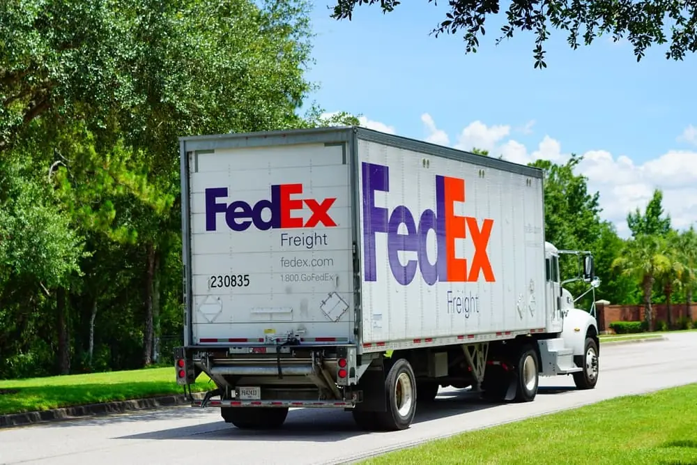 FedEx Freight Truck deliver package in a community