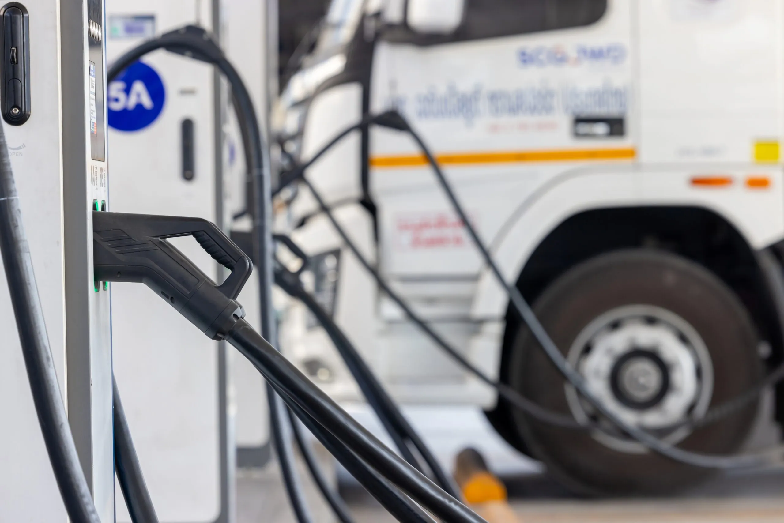 EV charging station electric truck in background
