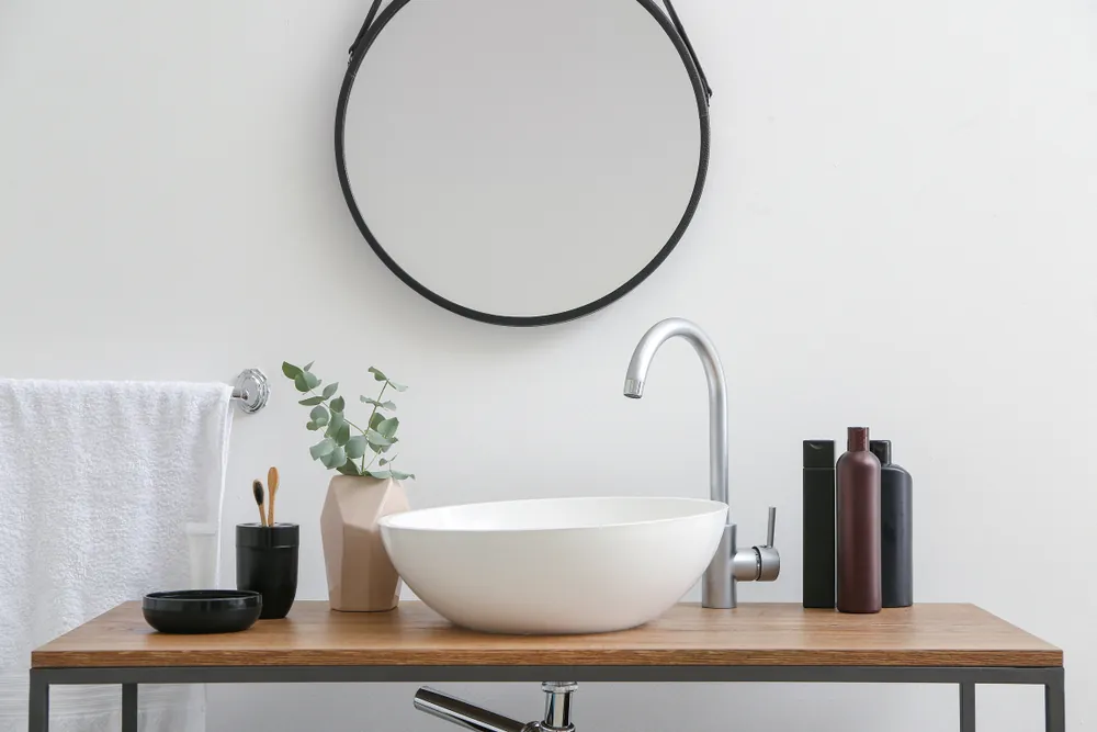bathroom sink with mirror and accessories