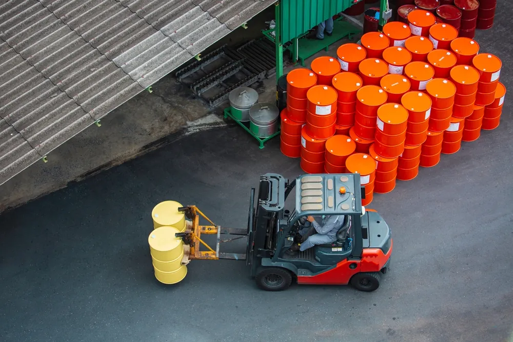 forklift transporting barrels