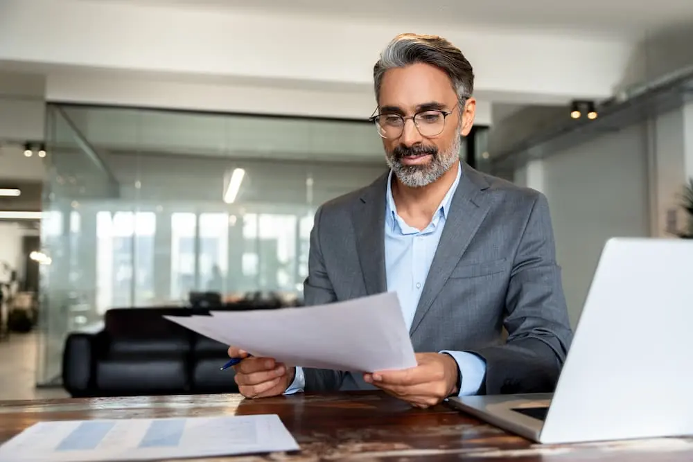 Is Your Freight Shipping Strategy Costing You Customers businessperson looking at business strategy plans