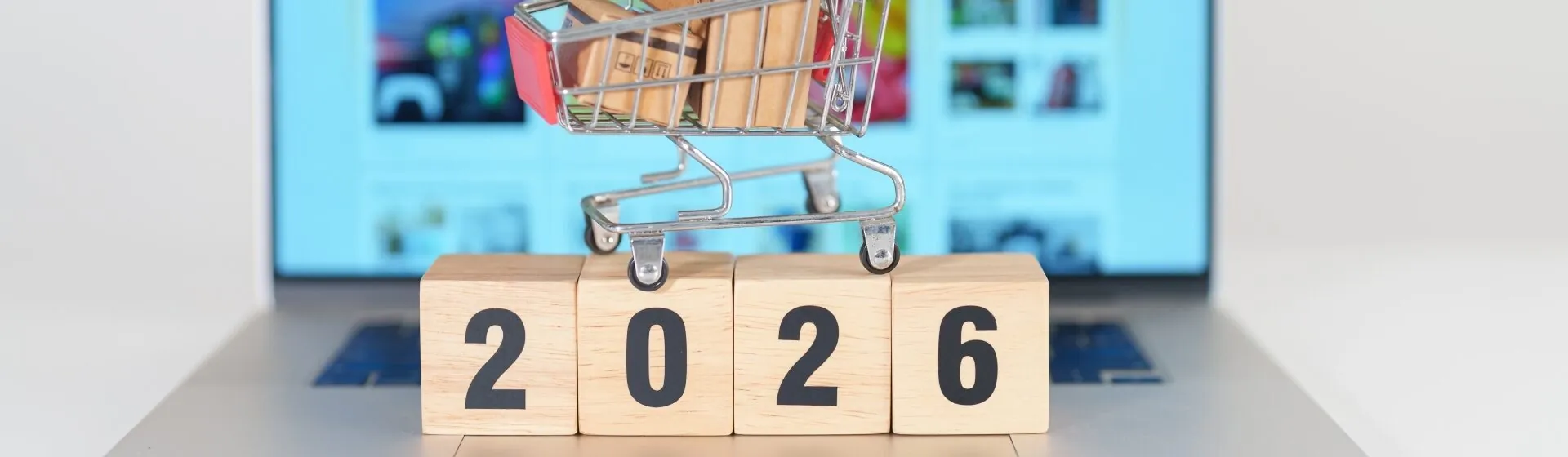 2026 blocks on computer with shopping cart on top, Retail Industry
