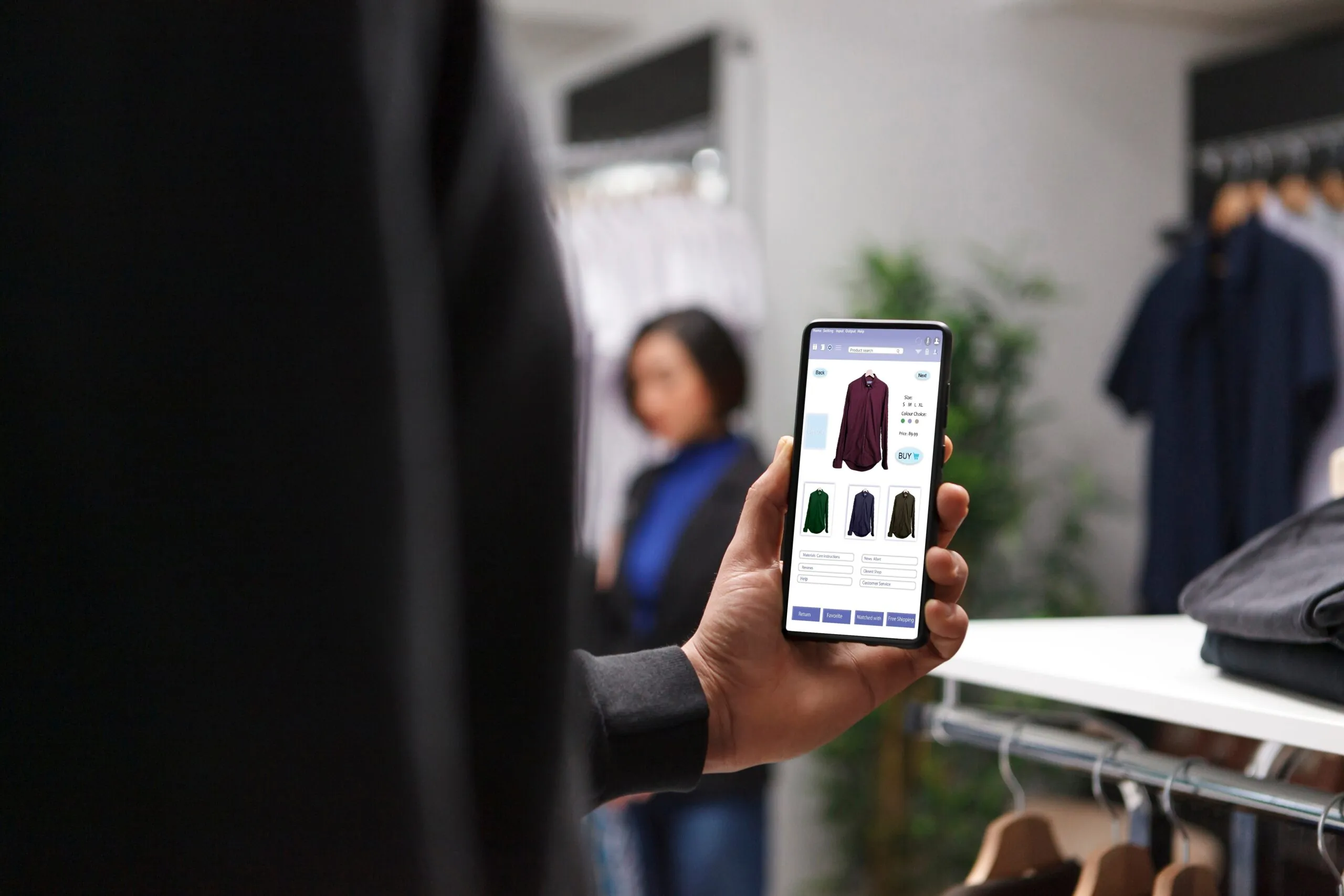 person in store browsing items on phone