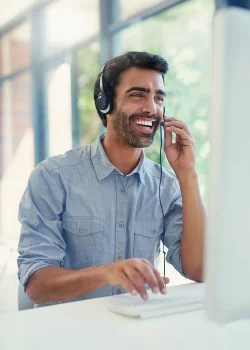 Customer Service Agent chats happily on headset