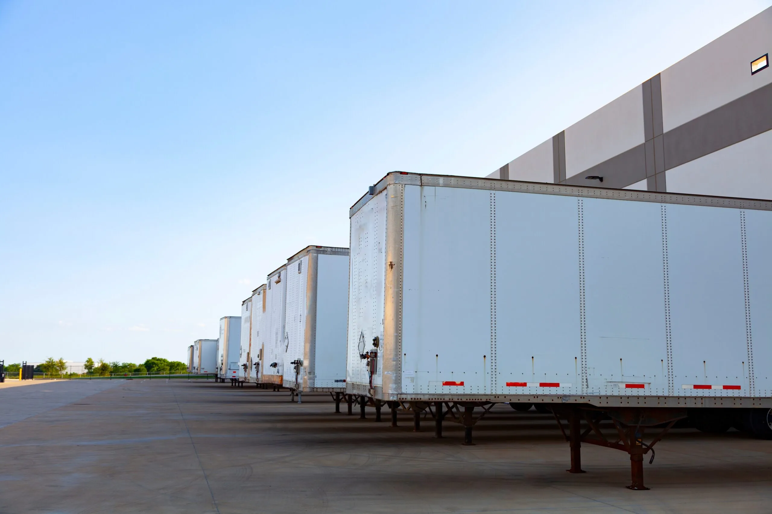 truck trailers parked at distribution center