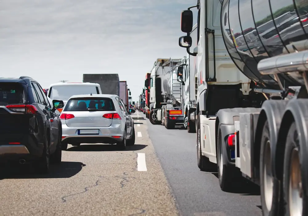 Industry News March 2026 trucks and cars idling in traffic