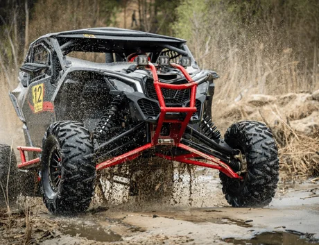 4x4 off-road vehicle in muddy water