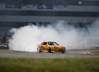 race car drifting on a professional track