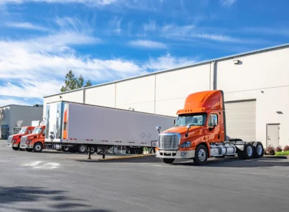 semi trucks parked at a cross dock facility