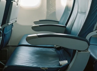 airplane seat with a little visible wear and tear