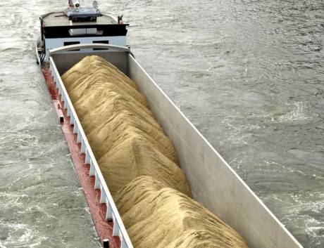 Barge-Shipping-barge-carrying-grain-sails-through-choppy-river-Factor
