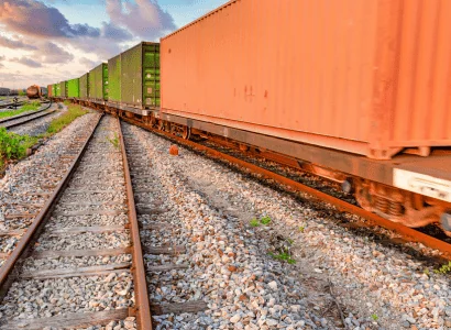 Barge Shipping freight train on track in rail yard