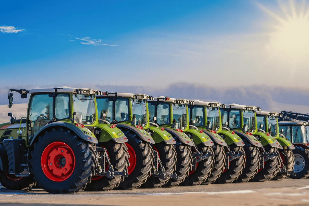 Packaging Machinery Equipment row of tractors on farmland