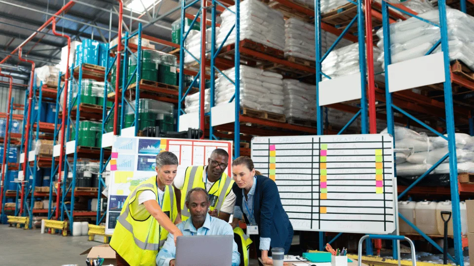 Team members meeting in a warehouse