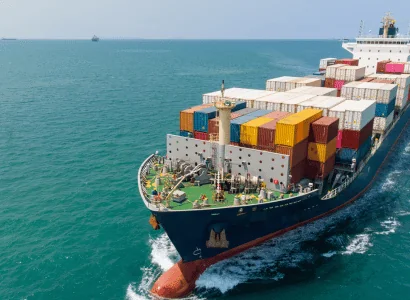 Printing Press Shipping container ship sailing on the ocean on clear sunny day
