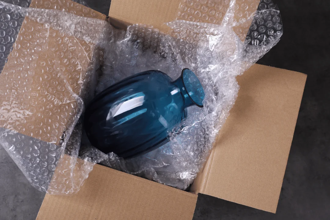 Special Requirements When Shipping Freight blue opaque vase on top of bubble wrap in open cardboard box