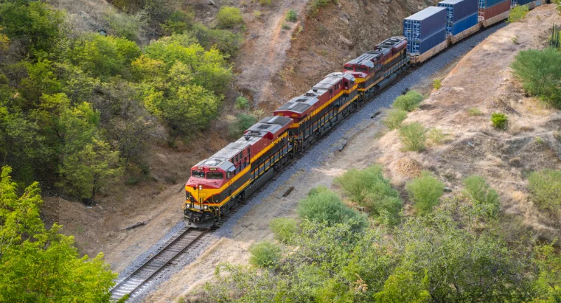high view of a train going through the desert