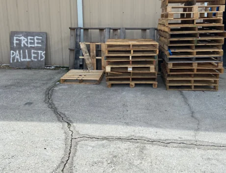 Where-To-Get-Free-Pallets-Stack-Of-Pallets-In-Front-Of-Garden