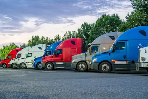 row of different colored semi trucks