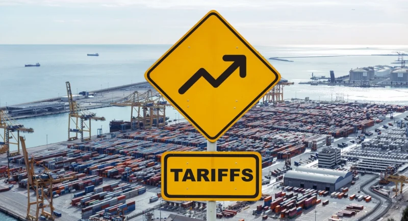 yellow road sign that says tariffs with a up arrow