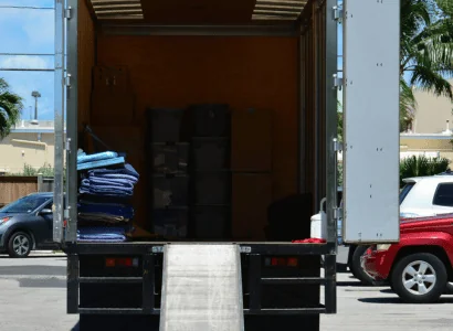 stacked moving blankets in truck with other moving items