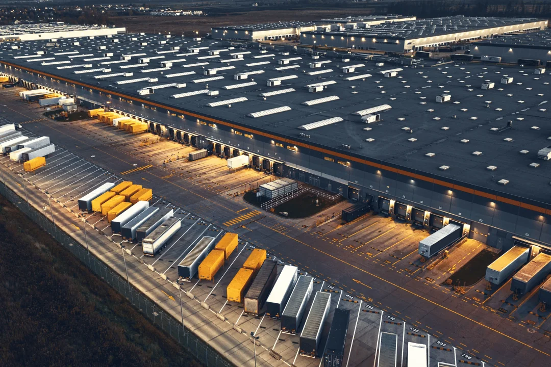 Party logistics from 1 to 5 aerial view of a logistics distribution center at night