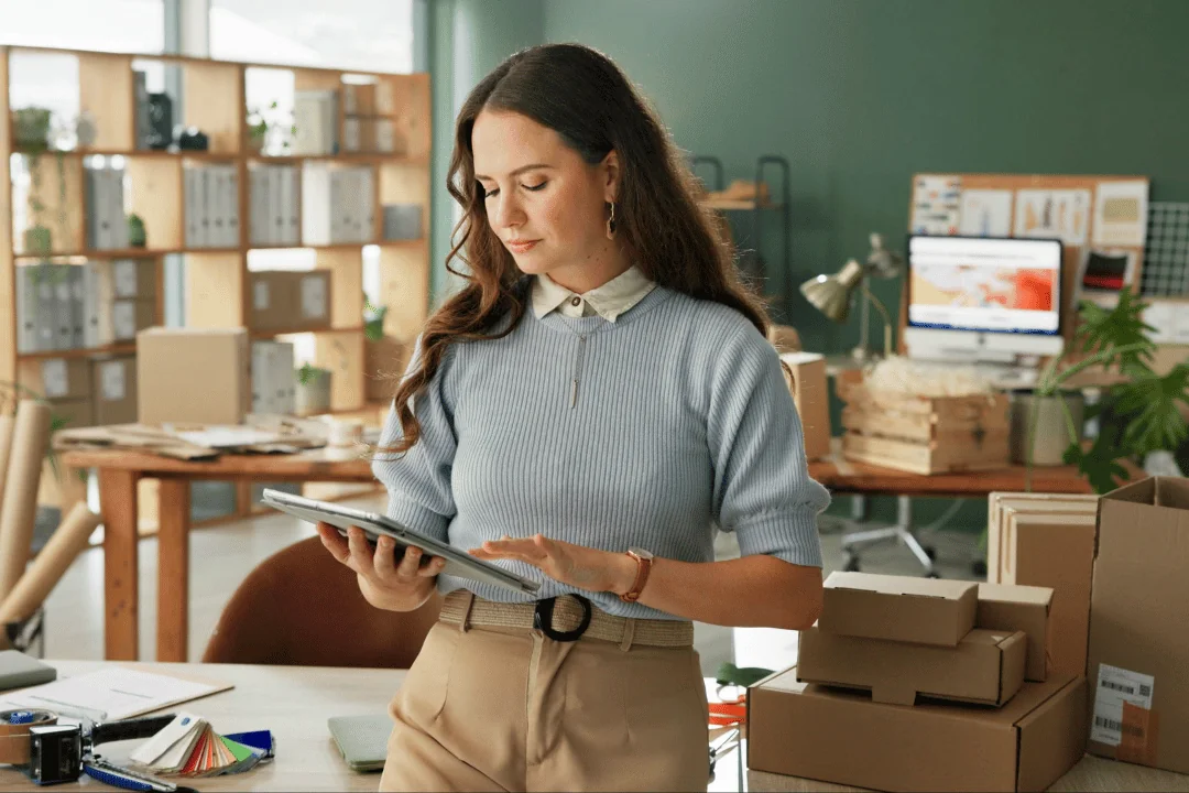 Party-logistics-from-1-to-5-ecommerce-business-woman-analyzing-sales-on-a-tablet