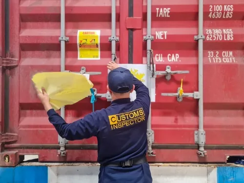 customs officer at container