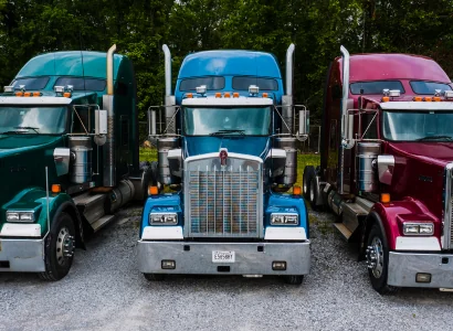 row of semi truck cabs parked