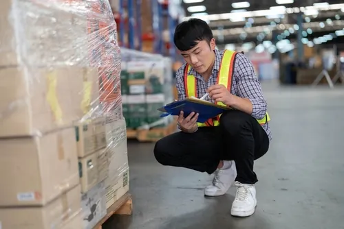 worker inspecting packaging