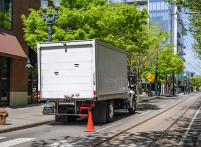 big box trailer standing on the urban city street making the local delivery
